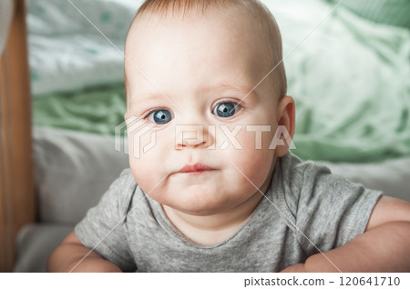 Curious Baby Standing in a Wooden Crib Curious Baby Standing in a Wooden Crib 120641710