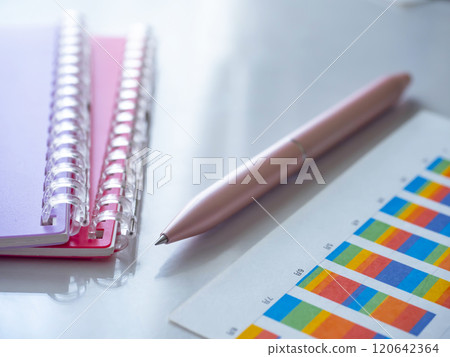 Graphs and notebooks on the table Graphs and notebooks on the table 120642364