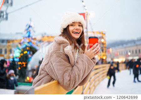 Woman enjoying winter moments. Festive Christmas fair, winter holidays concept. Woman enjoying winter moments. Festive Christmas fair, winter holidays concept. 120642699