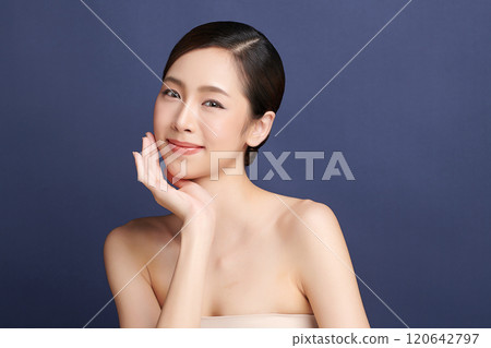 Beautiful young asian woman with clean fresh skin on blue background, Face care, Facial treatment, Cosmetology, beauty and spa, Asian women portrait. 120642797