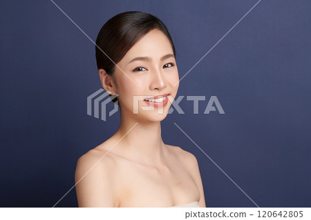 Beautiful young asian woman with clean fresh skin on blue background, Face care, Facial treatment, Cosmetology, beauty and spa, Asian women portrait. Beautiful young asian woman with clean fresh skin on blue background, Face care, Facial treatment, Cosmetology, beauty and spa, Asian women portrait. 120642805