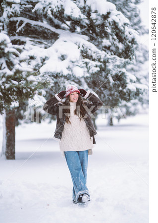 Woman Wearing Fashionable Winter Clothes walking in winter nature. Holidays, rest, concept. 120642878