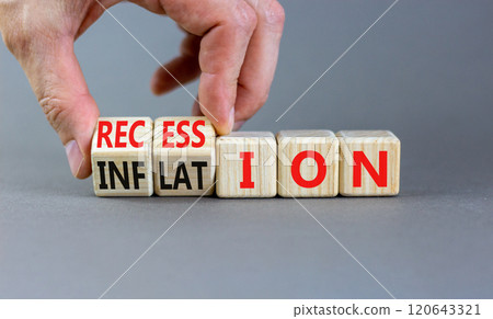 Inflation and recession symbol. Businessman turns wooden cubes and changes word Recession to Inflation. Beautiful grey table grey background. Business and inflation or recession concept. Copy space. 120643321