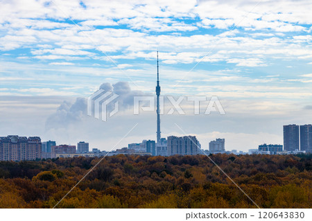 blue cloudy sky over city block and park in autumn 120643830