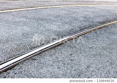 steel rails of tram tracks on city street 120644016