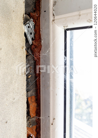 gap in brick wall after installing plastic window 120644020