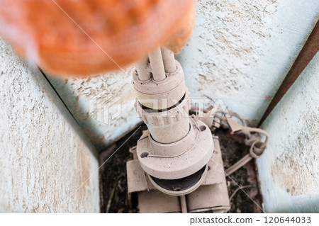 replacing old halogen lamp inside street light replacing old halogen lamp inside street light 120644033