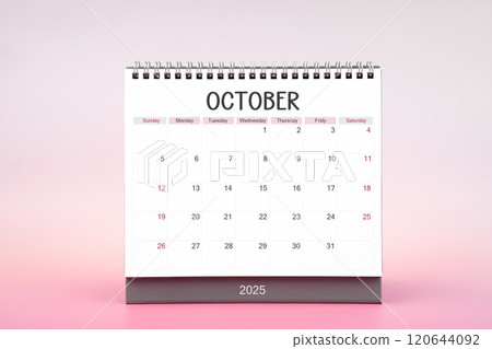 Desktop monthly calendar for October 2025 on pink background. 120644092