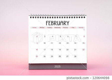 Desktop monthly calendar for February 2025 on pink background. 120644098