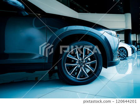 Luxury automotive showcasing premium vehicle design details in contemporary car showroom. Elegant modern car display in prestigious dealership showroom. Vehicle premium features and alloy wheels. Luxury automotive showcasing premium vehicle design details in contemporary car showroom. Elegant modern car display in prestigious dealership showroom. Vehicle premium features and alloy wheels. 120644201