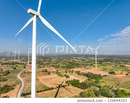 Wind energy and sustainable power generation with wind turbines, Eco-friendly solutions for renewable resources. Wind power farm and sustainable development of renewable energy, green technology. 120644203