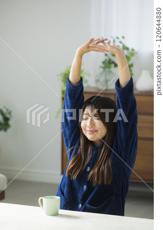 Young woman relaxing in a room 120644880