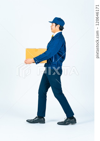 Full-body photo of a delivery person walking with a package Full-body photo of a delivery person walking with a package 120646171