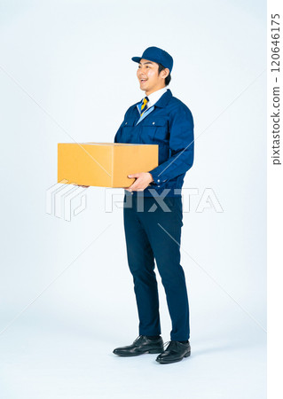 Full-body photo of a delivery person or delivery staff carrying a package 120646175