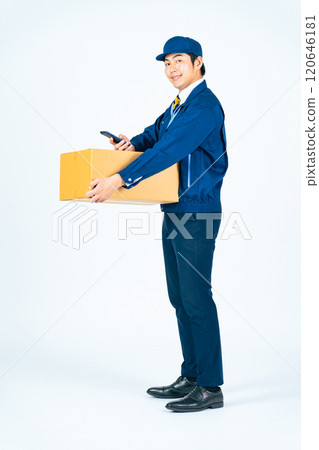 Full-body photo of a delivery person scanning a package with a smartphone Full-body photo of a delivery person scanning a package with a smartphone 120646181