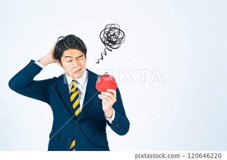 A male business person worried about his wallet A male business person worried about his wallet 120646220