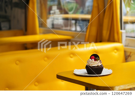 A sponge cake is on a table in a cafe 120647269
