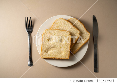 Gluten allergy, slice of fresh toast bread with sad face. Gluten free food. 120647681