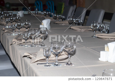 Restaurant interior. Preparation for a buffet. Tableware and food. Restaurant interior. Preparation for a buffet. Tableware and food. 120647871