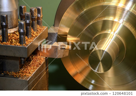 The lathe machine finish cut the brass material parts by lathe tools. The lathe machine finish cut the brass material parts by lathe tools. 120648101