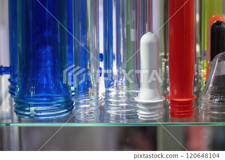 Close up scene of group of preform shape of PET bottle products. Close up scene of group of preform shape of PET bottle products. 120648104