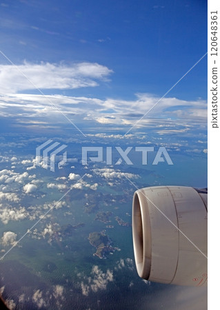 Stunning aerial view of clouds from airplane window showcasing a serene and breathtaking sky scenery Stunning aerial view of clouds from airplane window showcasing a serene and breathtaking sky scenery 120648361