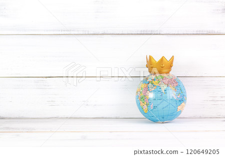 Global Dominance: Crowned World Globe on White Rustic Background Representing Leadership 120649205