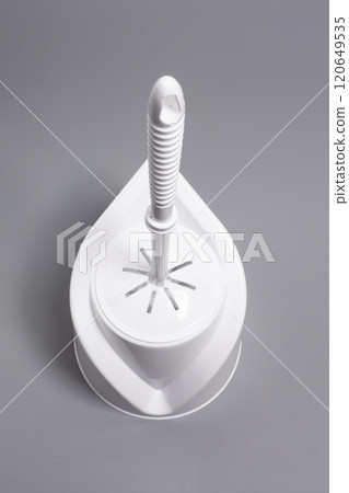While toilet brush on gray background While toilet brush on gray background 120649535