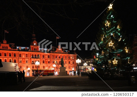Festive Christmas Tree and Illuminated Building in Sundsvall, Sweden 120650317