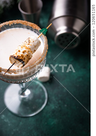 Christmas cocktail with toasted marshmellow Christmas cocktail with toasted marshmellow 120651165