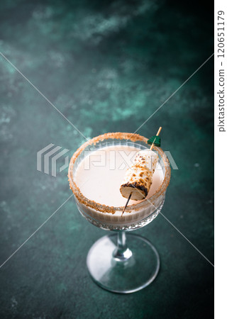 Christmas cocktail with toasted marshmellow Christmas cocktail with toasted marshmellow 120651179
