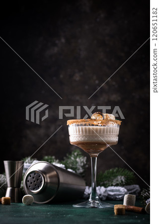 Christmas cocktail with toasted marshmellow Christmas cocktail with toasted marshmellow 120651182