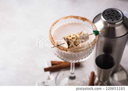 Christmas cocktail with toasted marshmellow Christmas cocktail with toasted marshmellow 120651183