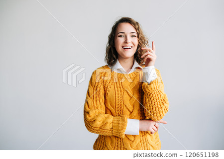 Young Woman Student Has Eureka Moment - Excited, Clever, Pointing Up with New Idea - Wow Promotion Young Woman Student Has Eureka Moment - Excited, Clever, Pointing Up with New Idea - Wow Promotion 120651198