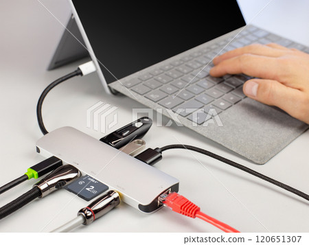 Multi-Port USB Hub Connected to Laptop 120651307