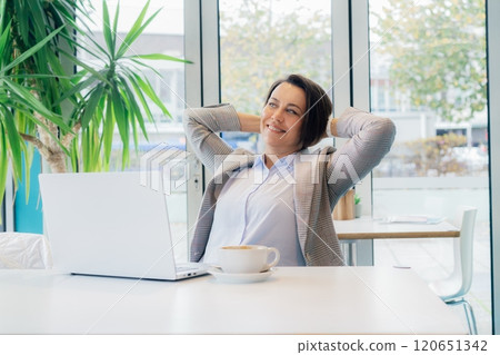 Relaxed happy 50's mature businesswoman, middle-aged experienced female feeling satisfied with done job rejoicing, got good news, overjoyed motivated lady received good results while working on pc. Relaxed happy 50's mature businesswoman, middle-aged experienced female feeling satisfied with done job rejoicing, got good news, overjoyed motivated lady received good results while working on pc. 120651342