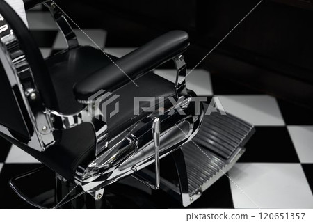 Classic barber chair in modern barbershop with black and white floor design Classic barber chair in modern barbershop with black and white floor design 120651357