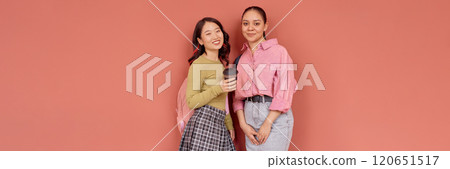 Header image of two smiling multiethnic girls wearing colorful preppy outfits Header image of two smiling multiethnic girls wearing colorful preppy outfits 120651517
