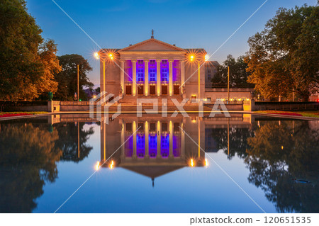Fountain in Adam Mickiewicz Park and Poznan Grand Opera during the blue hour before dawn. Fountain in Adam Mickiewicz Park and Poznan Grand Opera during the blue hour before dawn. 120651535