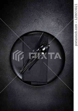 food background, with an empty black plate, black cutlery, with a napkin, on a black background, table setting, top view, no people, food background, with an empty black plate, black cutlery, with a napkin, on a black background, table setting, top view, no people, 120653021