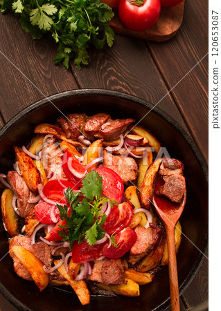 Ojakhuri, Traditional Georgian dish, fried potatoes with meat, in a clay frying pan, top view, no people, homemade, 120653087
