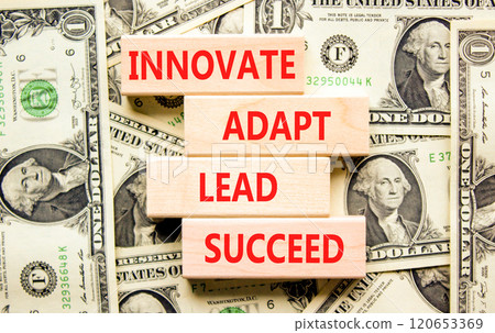 Innovate adapt lead succeed symbol. Concept words Innovate Adapt Lead Succeed on beautiful wooden blocks. Beautiful dollar bills background. Business innovate adapt lead succeed concept. Copy space. Innovate adapt lead succeed symbol. Concept words Innovate Adapt Lead Succeed on beautiful wooden blocks. Beautiful dollar bills background. Business innovate adapt lead succeed concept. Copy space. 120653369