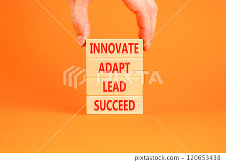 Innovate adapt lead succeed symbol. Concept words Innovate Adapt Lead Succeed on beautiful wooden blocks. Beautiful orange background. Business innovate adapt lead succeed concept. Copy space. Innovate adapt lead succeed symbol. Concept words Innovate Adapt Lead Succeed on beautiful wooden blocks. Beautiful orange background. Business innovate adapt lead succeed concept. Copy space. 120653438