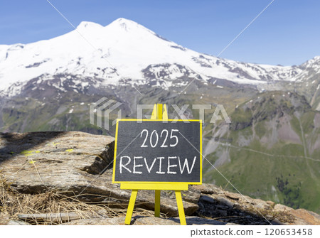 Planning 2025 review new year symbol. Concept words 2025 Review on beautiful yellow chalk blackboard. Beautiful mountain Elbrus background. Business 2025 review new year concept. Copy space. 120653458