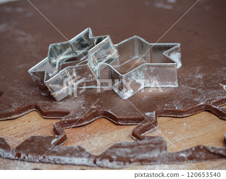 Star-Shaped Cookie Cutters on Brown Dough with Flour Star-Shaped Cookie Cutters on Brown Dough with Flour 120653540