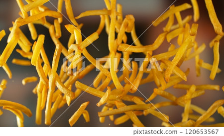 Freeze motion of flying french fries on gradient background Freeze motion of flying french fries on gradient background 120653567