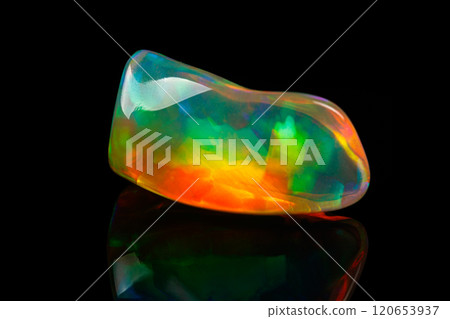 macro mineral stone rare and beautiful opals on a black background 120653937