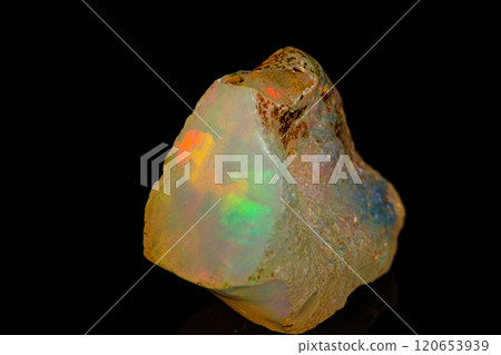 macro mineral stone rare and beautiful opals on a black background 120653939