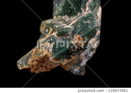 macro Axinite mineral stone on a black background macro Axinite mineral stone on a black background 120653981