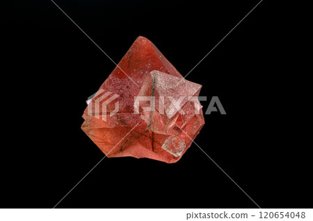 macro mineral stone pink fluorite on a black background 120654048